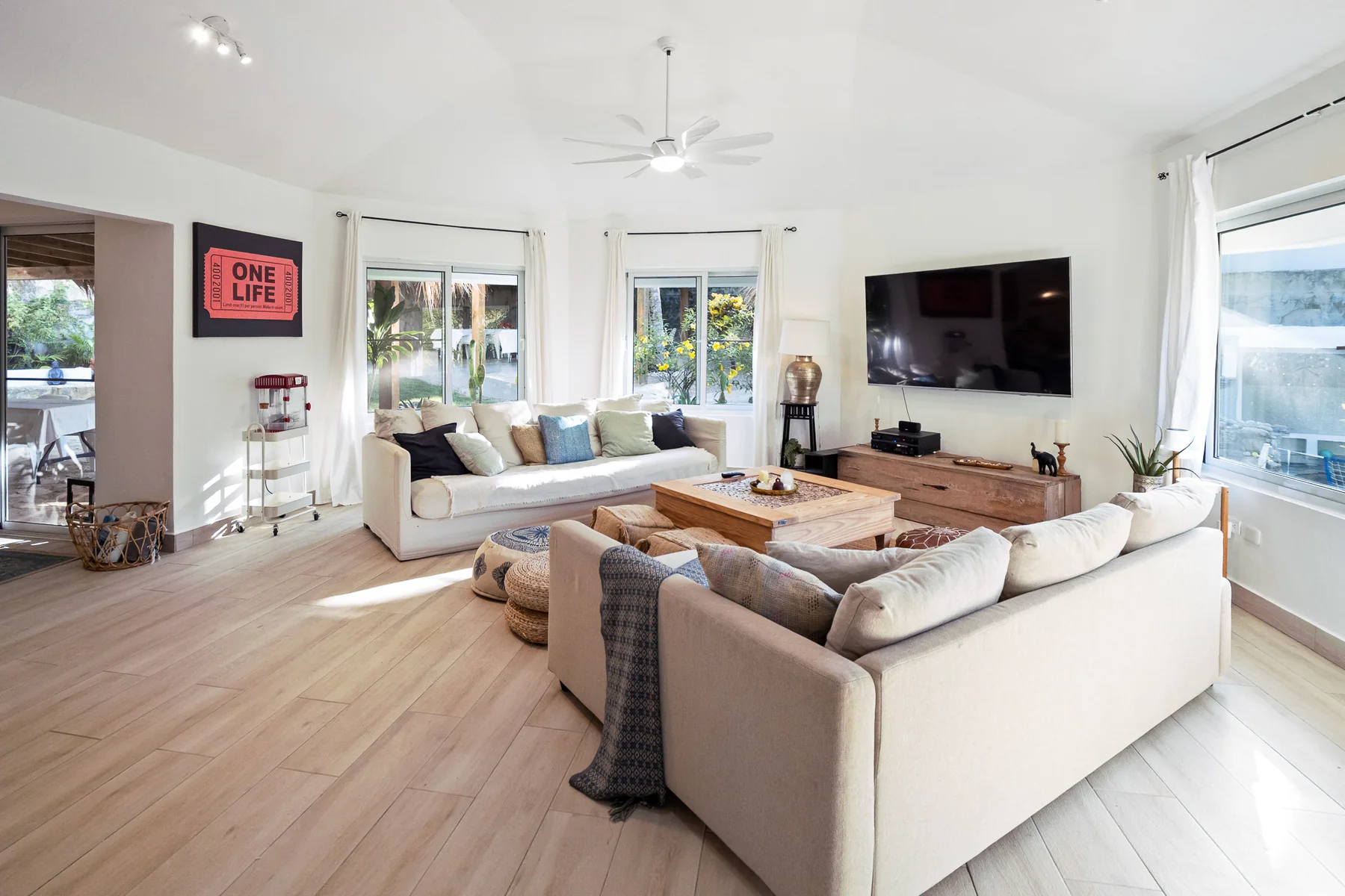 Light-filled living room opening to the outdoors