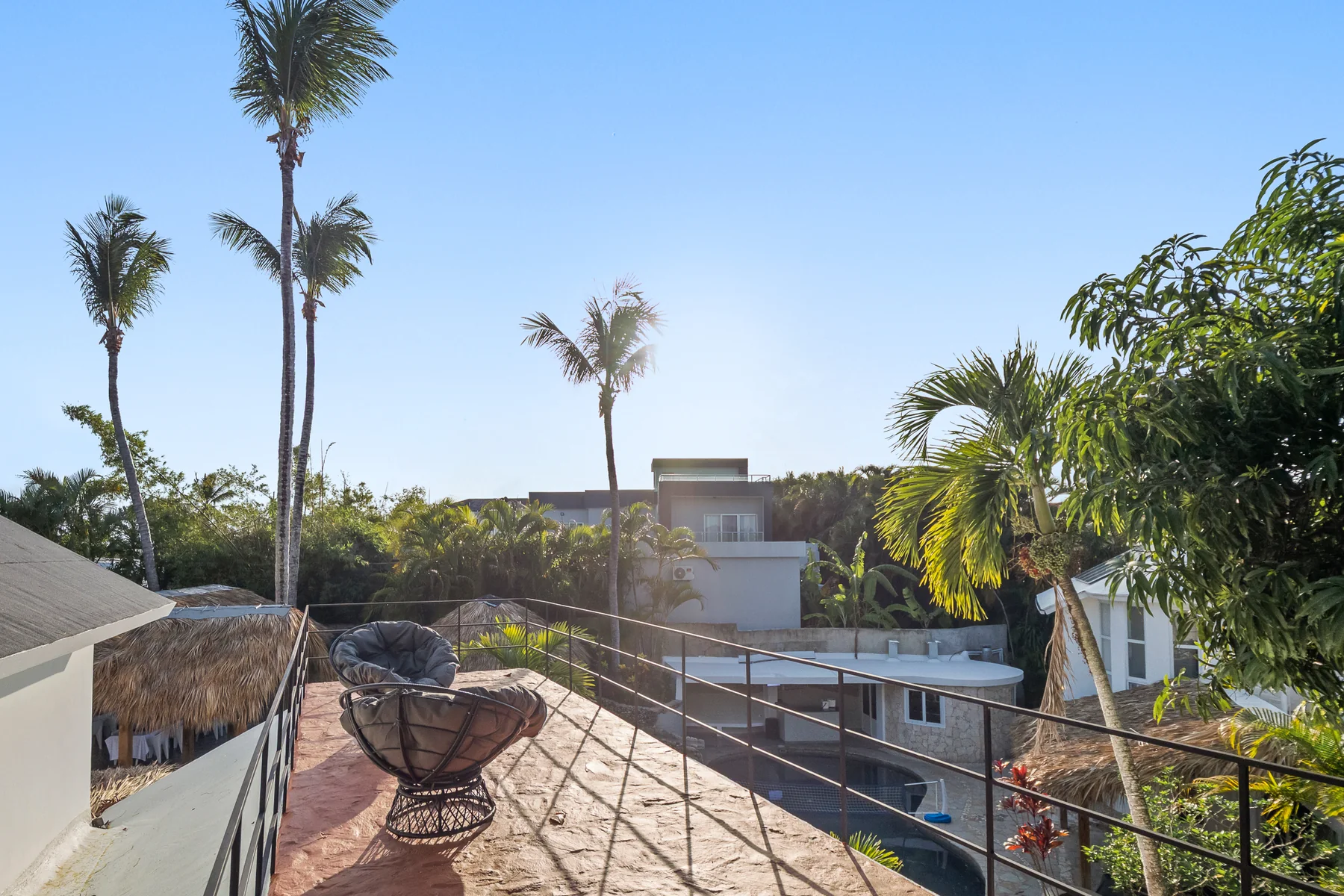 Terrace with ocean and palm views