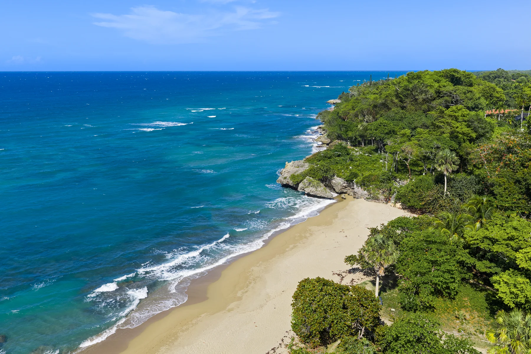 Turquoise North Coast water and a quiet sandy beach